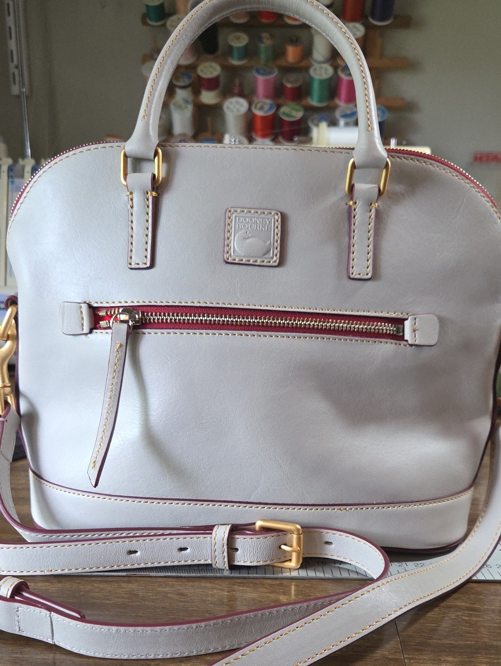 Dooney & Bourke Cream Leather Satchel with Red Trim